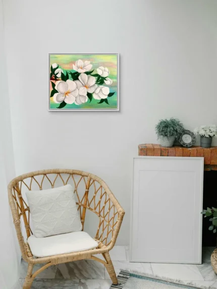 Tablou canvas Primavara Inflorita pe un perete alb, langa un fotoliu din ratan