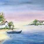 Tablou Pe malul lacului, case albe si copaci verzi pe malul unui lac albastru, cu o barca