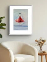 Apropiere pe tabloul cu balerina in rochie rosie, pe perete bej, deasupra fotoliului alb